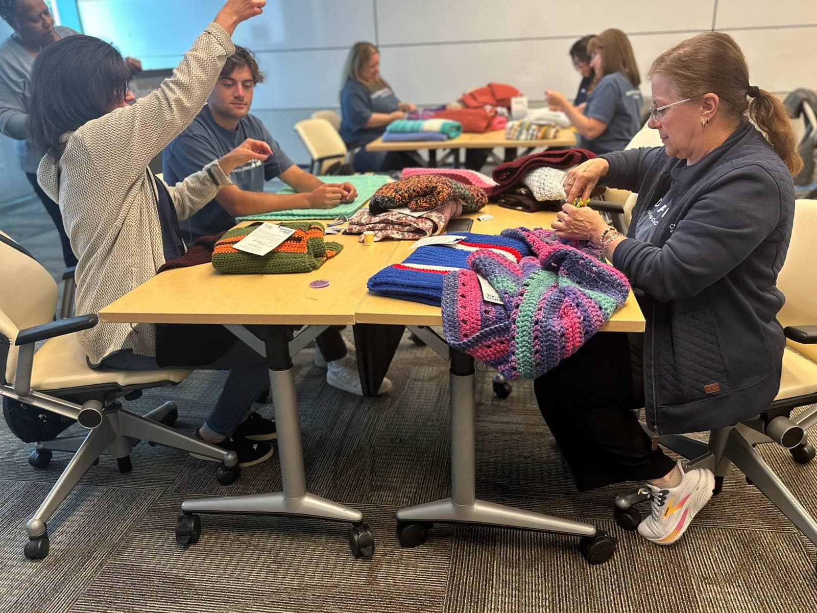Employees of Clyde Paul Agency, Inc.’s Summit and New Providence locations joined forces at NJ Sharing Network’s headquarters in New Providence to support organ and tissue donor families through the Wrapped in Love program.